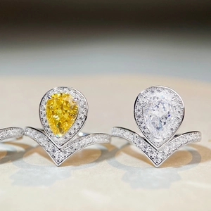 Pear cut yellow and white zircon rings with V-shaped halo pavé bands in S925 silver