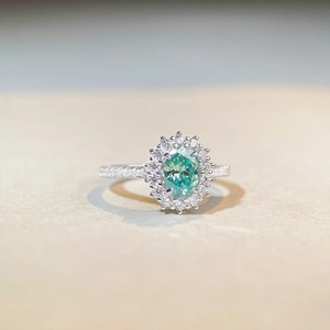 Classic 925 sterling silver ring with 1ct oval green moissanite and halo diamond setting
