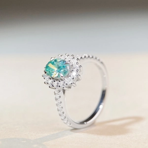 Classic 925 sterling silver halo ring featuring an oval teal moissanite gemstone