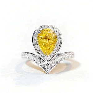 Pear cut yellow diamond V-shaped ring in 925 silver with halo pavé setting
