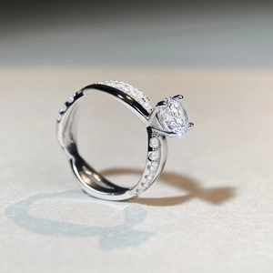 Classic 1ct moissanite ring with four-prong setting and twisted diamond band