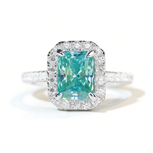 Radiant cut mint green moissanite halo ring in polished white gold plating
