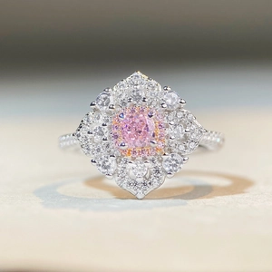 Macro view of floral S925 silver ring with pink ice flower cut stone and pavé diamonds