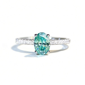 Oval cut mint green moissanite ring in 925 sterling silver with micro-paved band