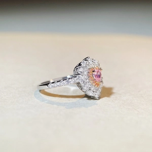 Elegant S925 silver ring featuring a heart-cut pink gemstone with a double halo design