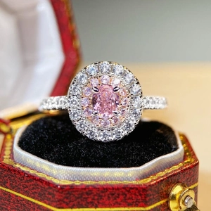 S925 sterling silver pink halo ring with oval cut diamond in a luxury red gift box
