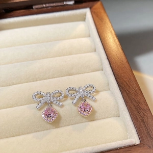 Sweet 925 silver bow stud earrings featuring pink square gems and white zircon inlay