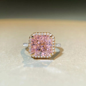 Macro shot of princess pink square carbon diamond ring with 18K gold claw setting