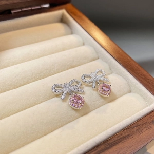 Elegant 925 sterling silver bow earrings with pink square gemstones and micro-pave crystals
