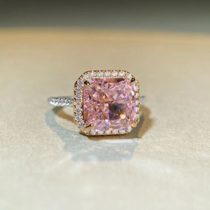 Macro detail of S925 silver ring featuring pink radiant cut stone and pavé halo setting