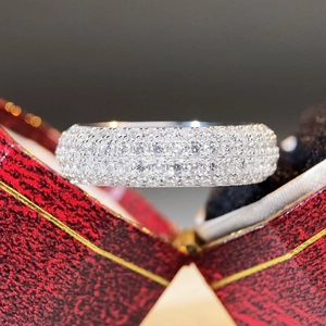 Close-up of S925 sterling silver iced out pavé ring with zircon in a red gift box