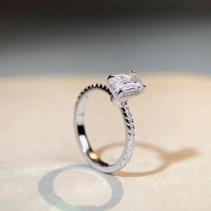 Detailed side view of 1ct emerald cut moissanite ring in S925 sterling silver setting