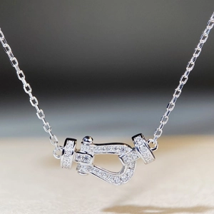 Close-up of S925 sterling silver horseshoe clasp necklace with sparkling zircon pavé