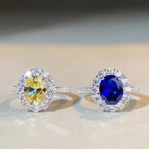 Elegant S925 silver halo rings featuring yellow and blue oval gemstones with pavé bands