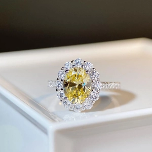 Luxurious S925 silver halo ring with oval yellow gemstone and white micro-paved diamonds