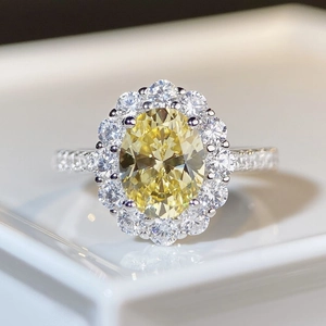 Luxurious S925 silver ring featuring an oval yellow gemstone with a sparkling diamond halo