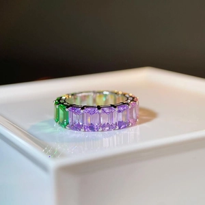 Macro shot of S925 sterling silver eternity ring with multi-color emerald cut stones