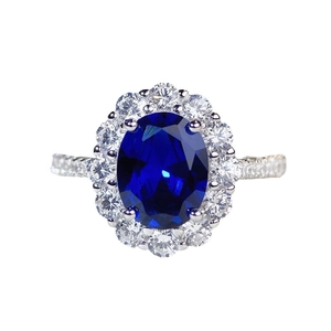 Elegant S925 sterling silver ring with oval blue sapphire and halo diamond setting