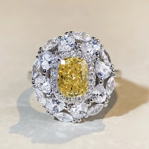 Macro shot of luxury S925 sterling silver ring with yellow cushion cut center stone