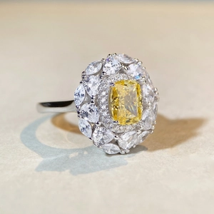 Macro detail of S925 silver ring featuring radiant yellow center stone and halo petals