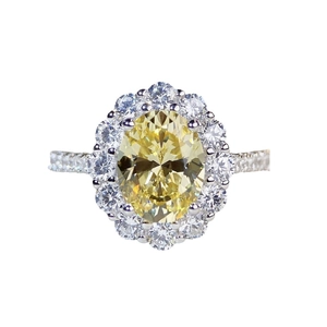 Luxurious S925 silver ring featuring an oval yellow halo gemstone and pavé band
