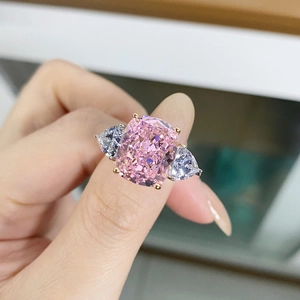 925 silver ring with pink cushion-cut stone and pear-shaped side accents in 4-prong setting