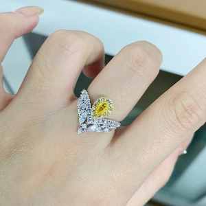 Luxurious S925 sterling silver ring featuring a pear-cut yellow stone and marquise diamonds