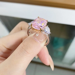 925 sterling silver three-stone ring with cushion-cut pink stone and pear side accents