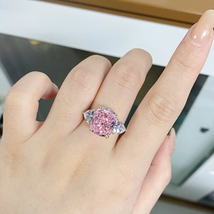 Detailed close-up of a 925 silver pink ice flower cut ring worn on a hand