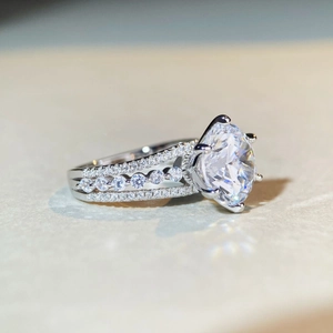Elegant S925 sterling silver ring with 5 carat moissanite featuring a triple-row band