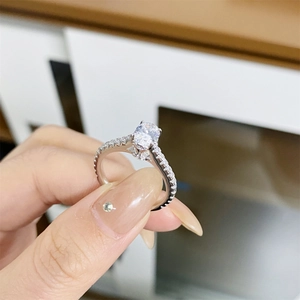 Classic S925 sterling silver ring with an oval moissanite stone and side accents