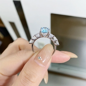 Macro view of S925 silver ring featuring a round light blue stone and marquise accents