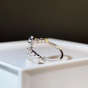 Macro shot of S925 sterling silver adjustable ring with pear cut diamond and pave settings