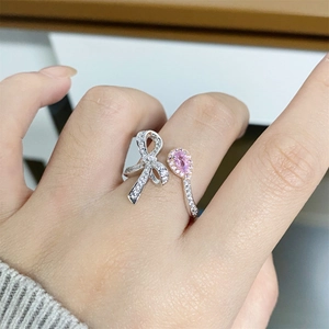 Adjustable S925 sterling silver bow ring with pink pear-cut stone and sparkling zircon