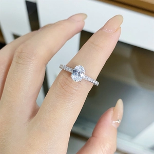 Close-up of S925 sterling silver ring with oval moissanite and micro-pave setting