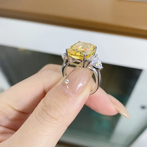 Three-stone S925 silver ring featuring a yellow radiant cut high carbon diamond center