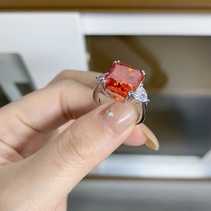 Radiant cut orange-red ruby gemstone ring in S925 sterling silver with side stones