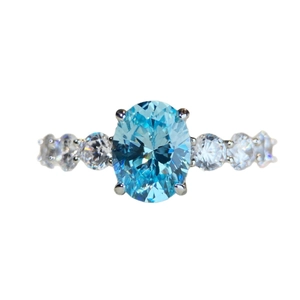 Elegant S925 sterling silver ring featuring oval blue aquamarine and white side stones