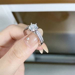 Classic six-prong 1 carat moissanite ring in sterling silver with pave side stones
