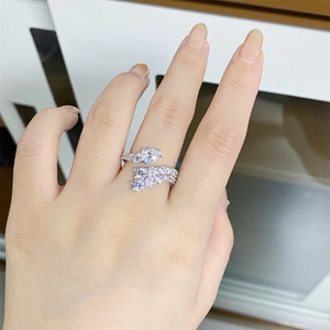 Detailed macro view of S925 sterling silver ring with pear-shaped and round-cut gemstones