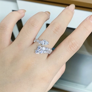 Macro shot of S925 sterling silver adjustable ring featuring teardrop cubic zirconia