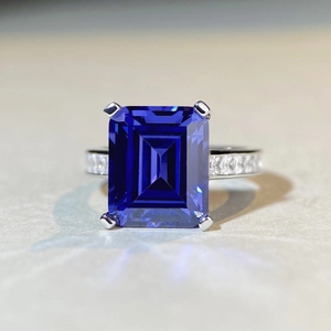 Classic 925 sterling silver ring with emerald-cut blue tanzanite stone and side diamonds