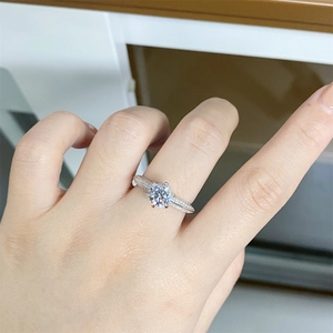 Close-up of S925 sterling silver ring with classic six-prong set moissanite stone