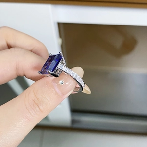 Macro shot of 925 silver ring featuring a large rectangular blue tanzanite gemstone