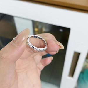 Minimalist S925 sterling silver band ring featuring a full row of sparkling zircon stones