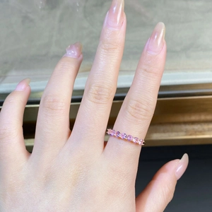 Macro shot of 7 pink cubic zirconia stones on a rose gold plated sterling silver band