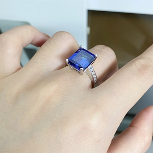Macro detail of 925 sterling silver ring with large rectangular blue tanzanite gemstone