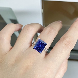 Macro detail of rectangle tanzanite ring with pavé diamonds on sterling silver band