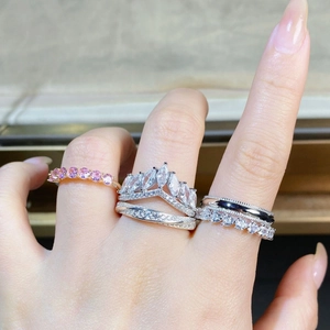Close-up of S925 silver rings set featuring pink zircon stones and crown design