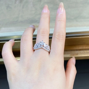 Detail of 925 silver crown ring with marquise-cut zircons and a V-shaped band